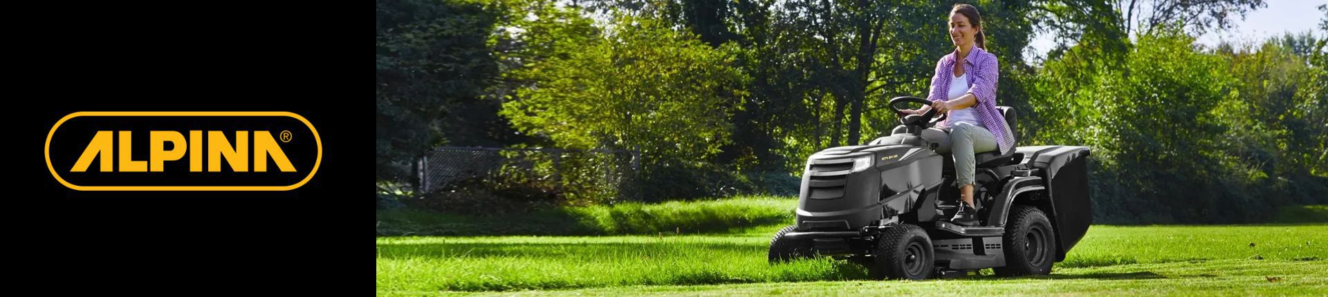 Bild Frau auf einem Alpina Rasentraktor beim Mähen einer Rasenfläche