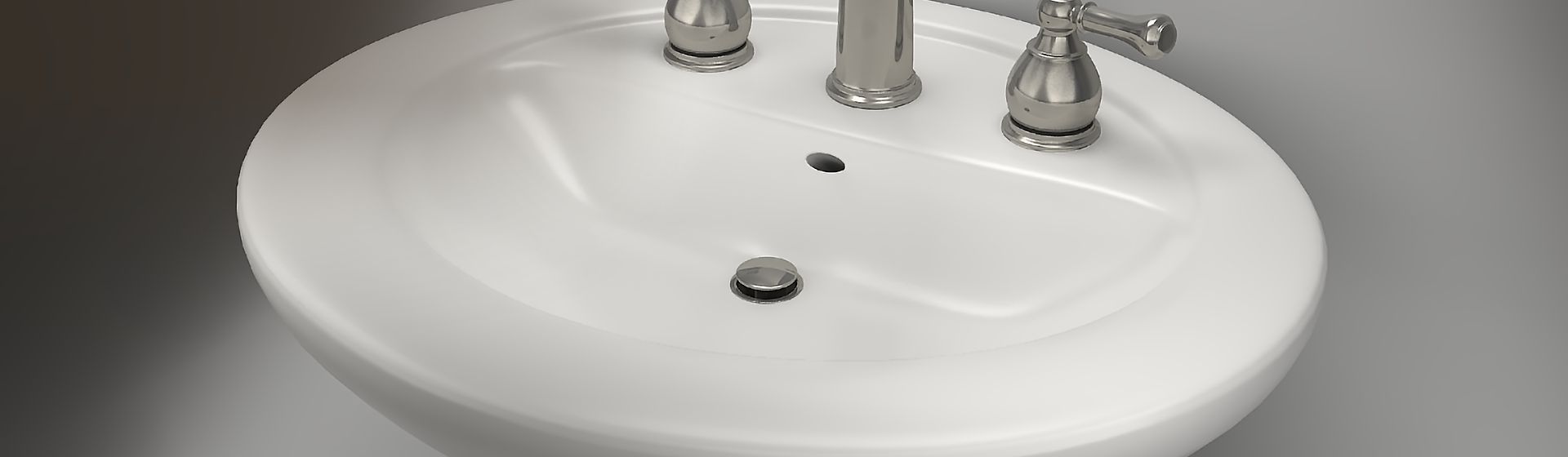 Blick auf den silberfarbenenAblauf in einem weißen Waschbecken bild